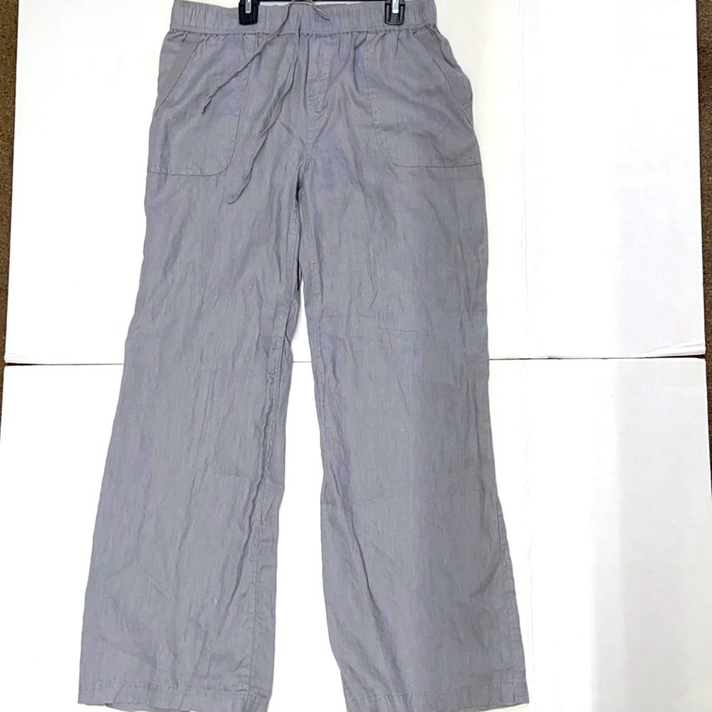 Gray linen pants with front and back pockets.
